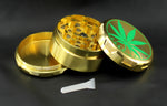 goldener Grinder mit Hanfblatt